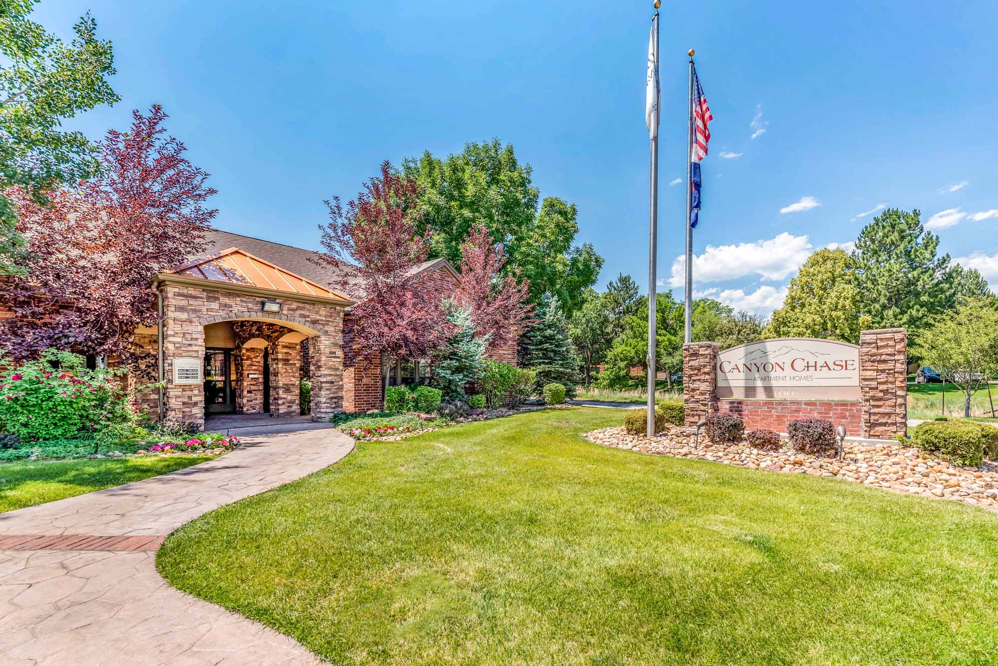 The entrance at Canyon Chase apartments in Westminster, CO.