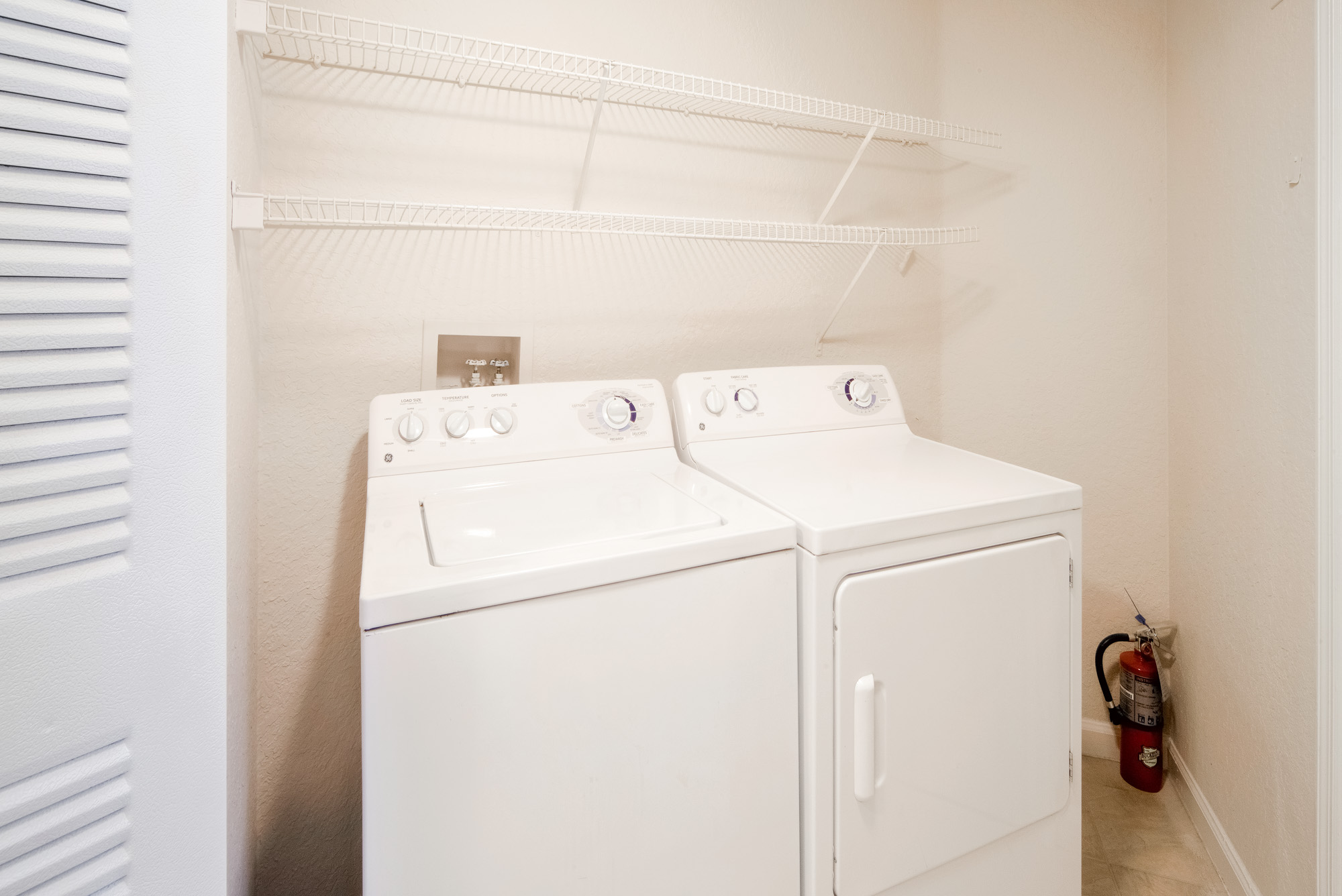 The washer and dryer in an apartment at Osprey Links at Hunter's Creek in Orlando, Florida.