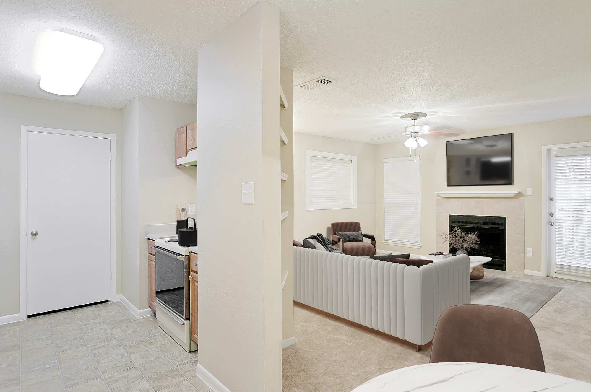 The living area of an apartment at The Arbors of Wells Branch in Austin, TX.