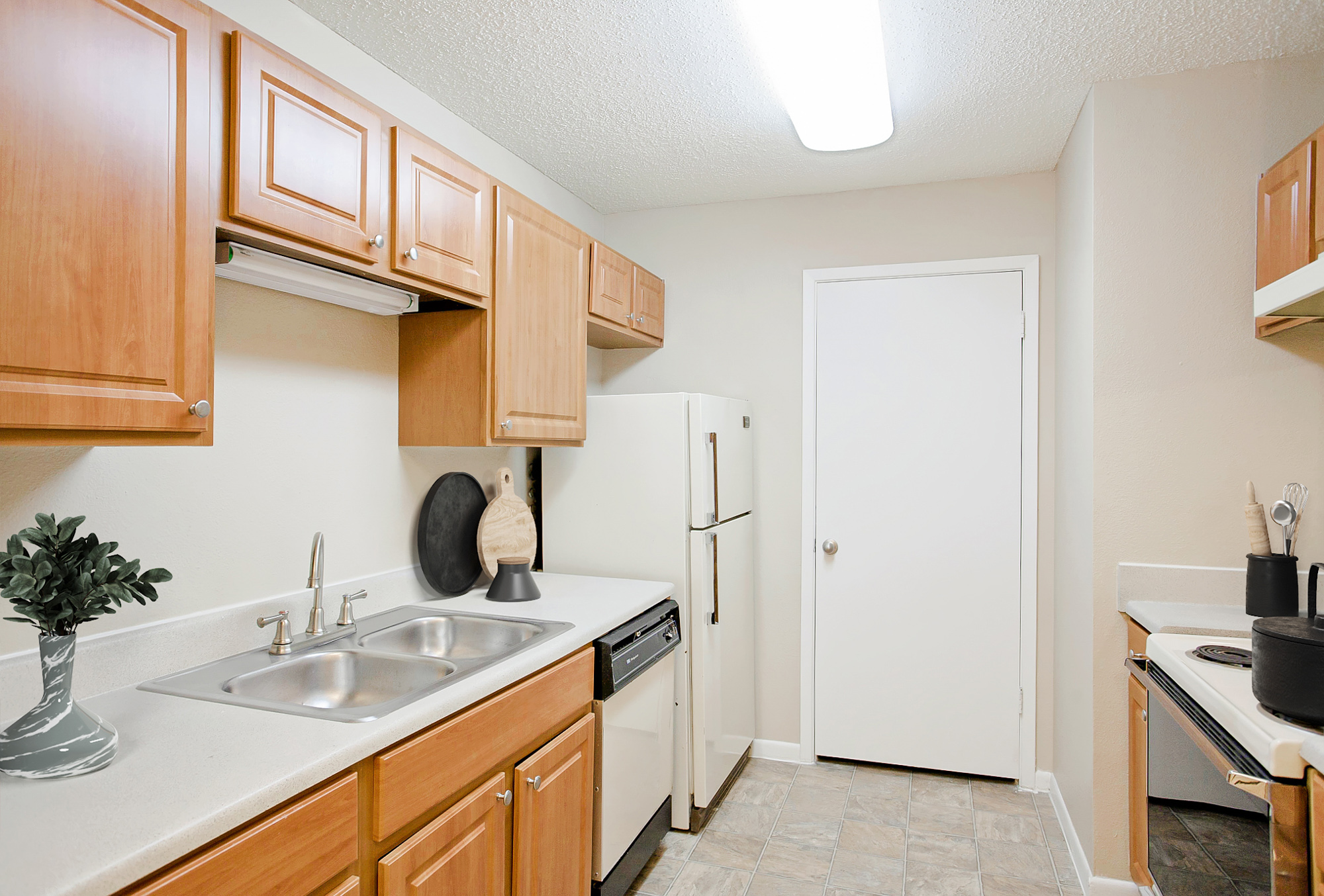 The kitchen of an apartment at The Arbors of Wells Branch in Austin, TX.