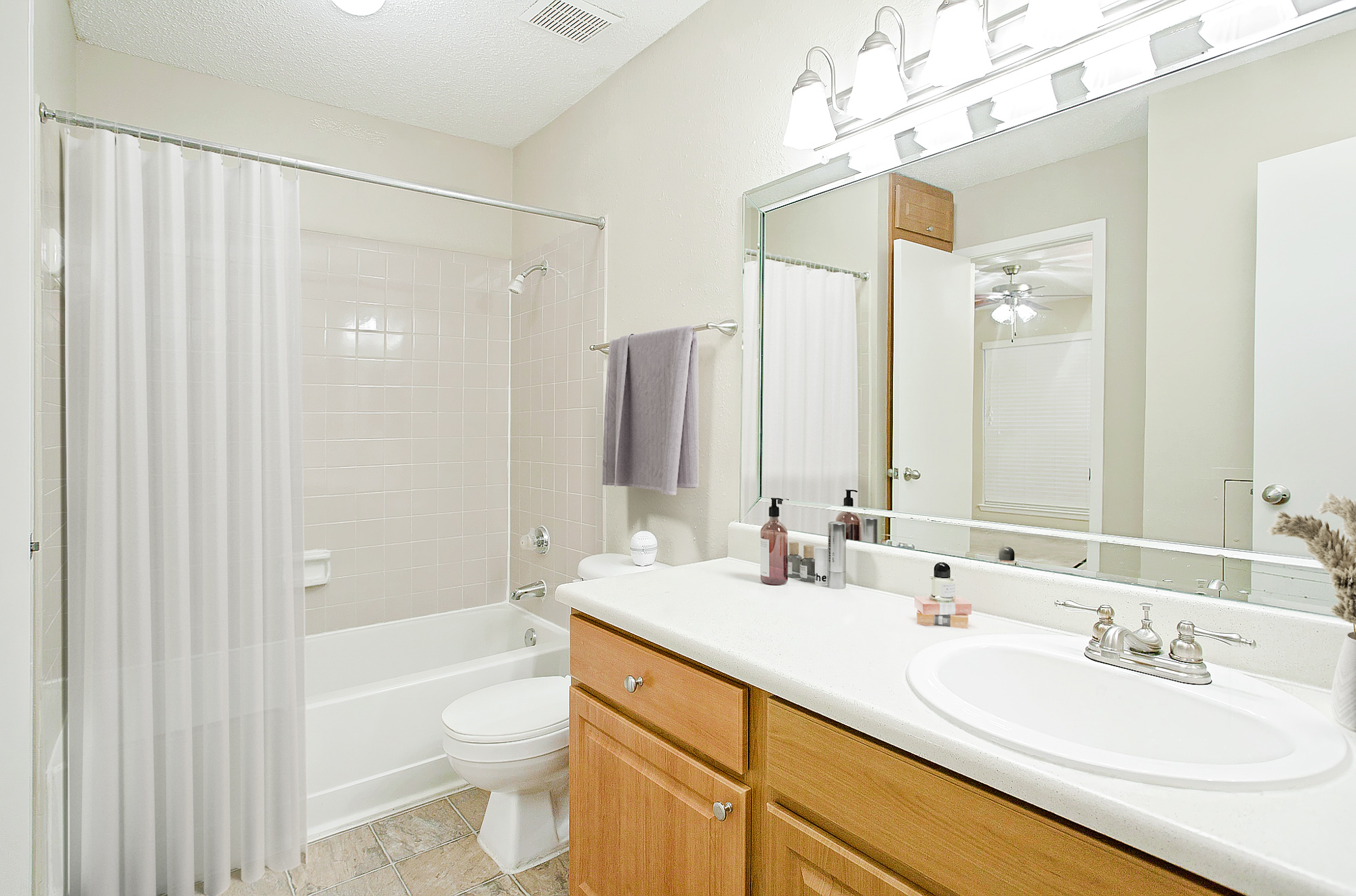 The bathroom of an apartment at The Arbors of Wells Branch in Austin, TX.