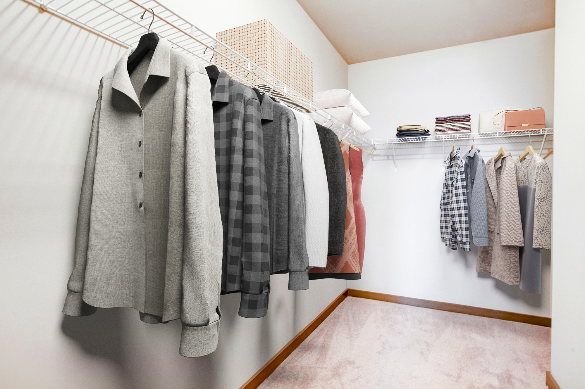 A walk-in closet with jackets and dresses hanging at Park 9 apartments in Woodstock, GA.